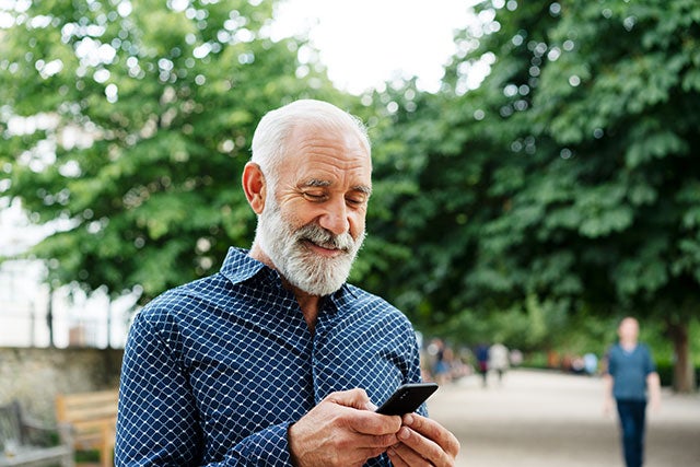 Man outside using cell phone.