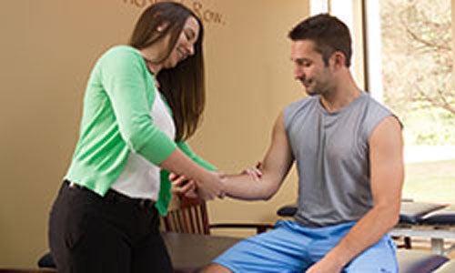 Younger male at a physical therapy appointment