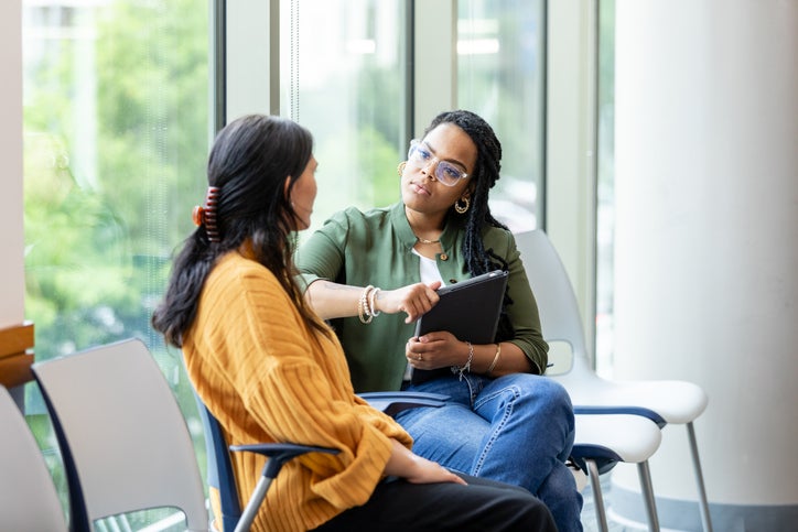 Woman speaks with her therapist