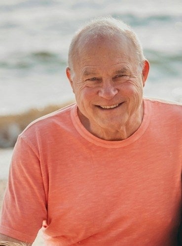 doctor Mark Oberdoerster smiling while visiting beach