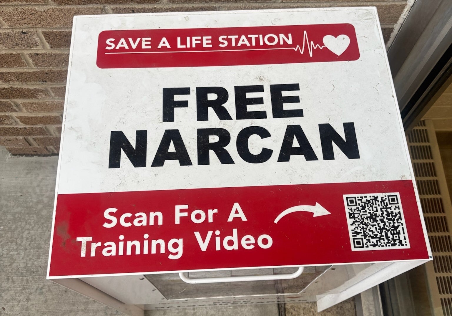 Top of Narcan Dispenser Showing QR Code for Training Video