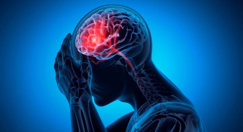 Person pressing hand to forehead