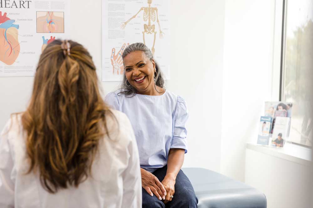 woman talking to physician