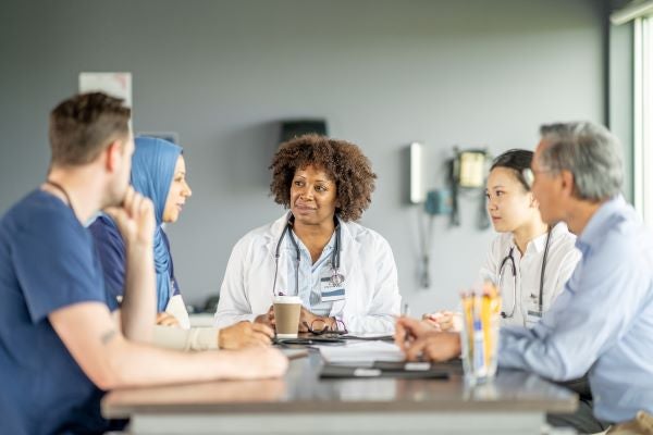 group of people talking at a table