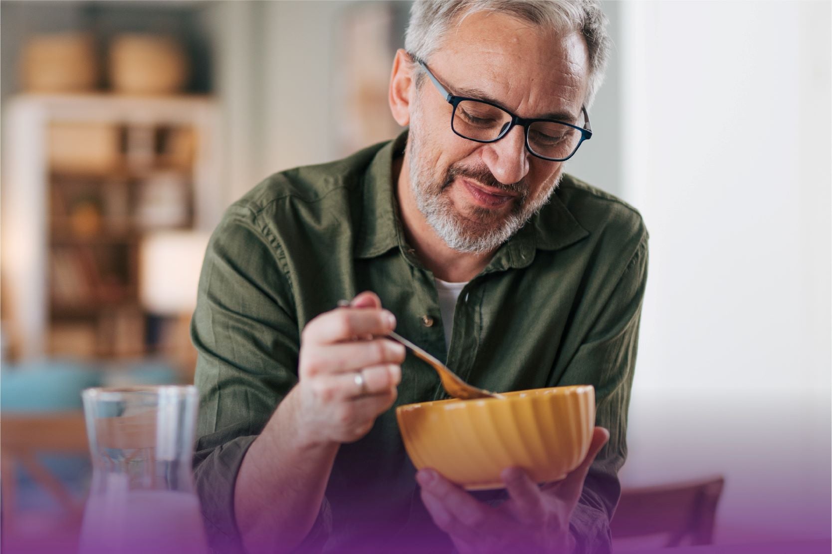 Man Eating Out of Bowl with Fork