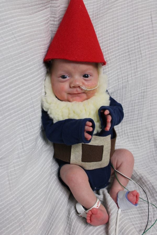 Tiny baby dressed as elf for Halloween