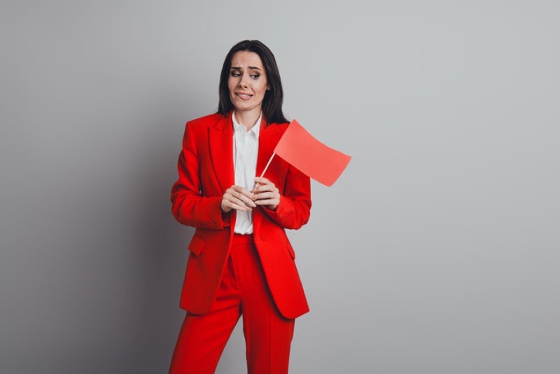 Woman holding a red flag