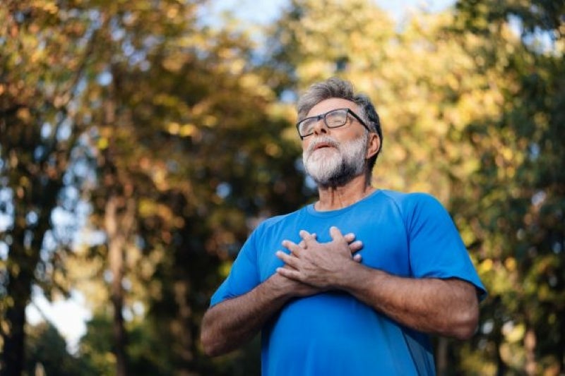Man with hands over heart