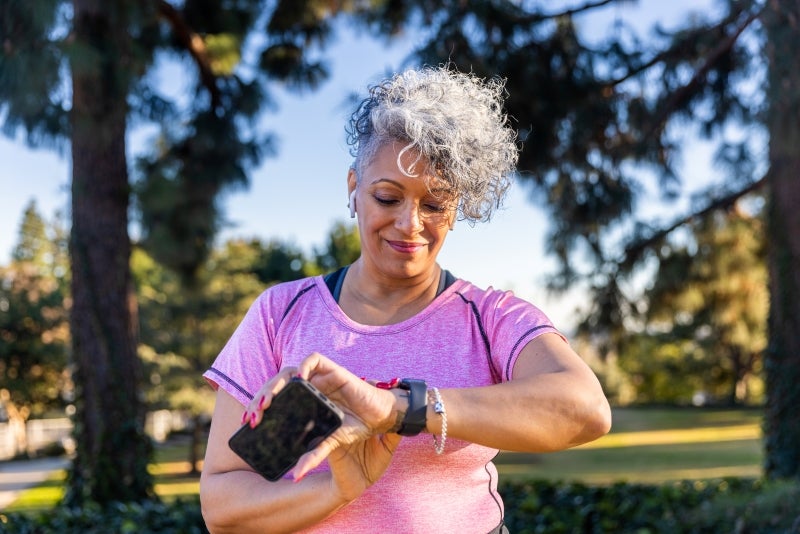 woman looking at her smartwatch