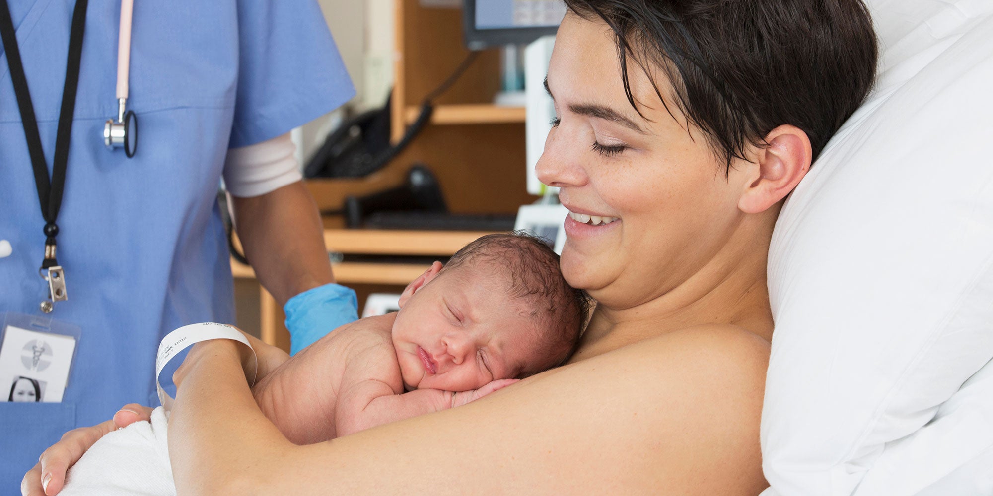 Mother with Newborn and Nurse Midwife