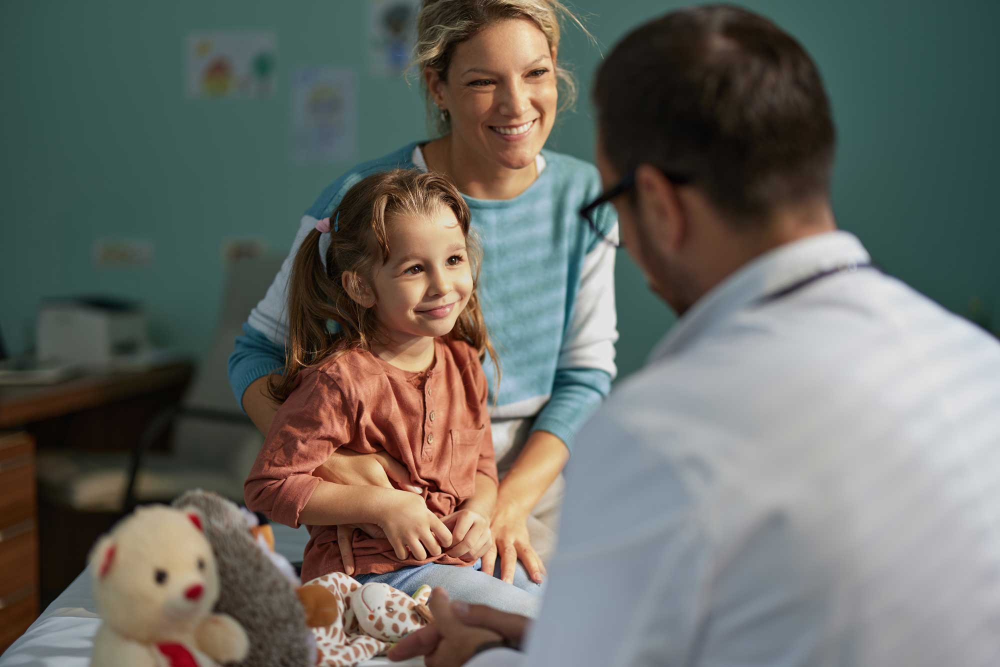 child with her pediatrician