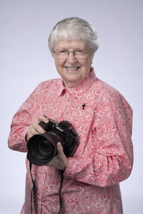 Sister Anne holding a camera